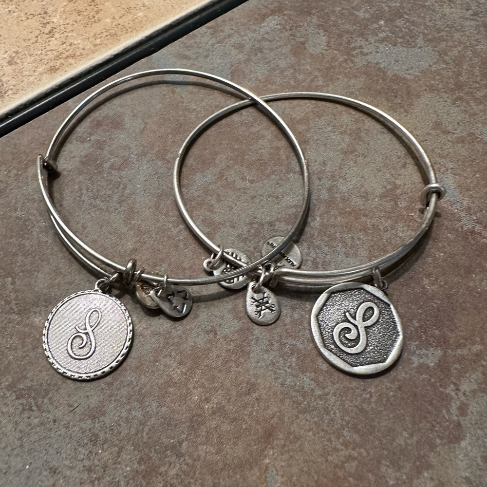 Two Alex & Ani silver tone “S” bangles